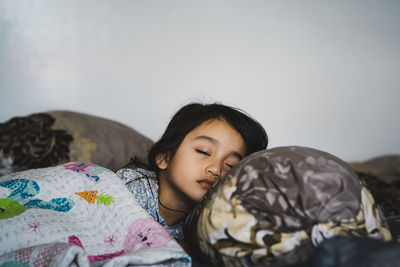 Cute girl relaxing on sofa at home