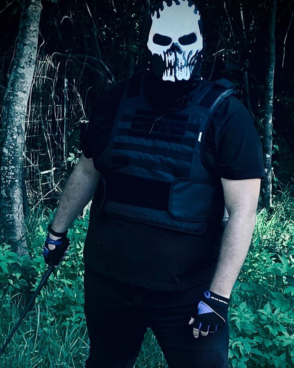 one person, darkness, mask, disguise, adult, spooky, mask - disguise, men, fear, plant, forest, clothing, nature, horror, standing, night, tree, evil, front view, black, outdoors, dark, halloween, three quarter length, person, protection, land, mystery