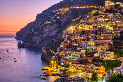 Aerial view of illuminated buildings in city