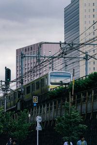 Train against buildings in city