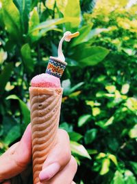 Close-up of hand holding ice cream cone