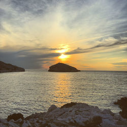 Scenic view of sea against sky during sunset