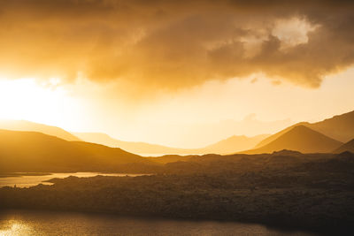 Scenic view of mountains against sky during sunset