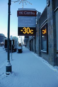 Road sign on street in city