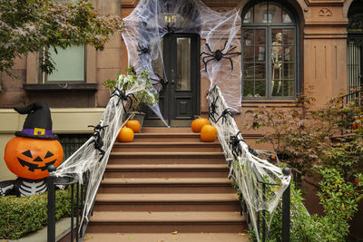 Front of apartment building decorated with spider web for halloween holiday in manhattan new york