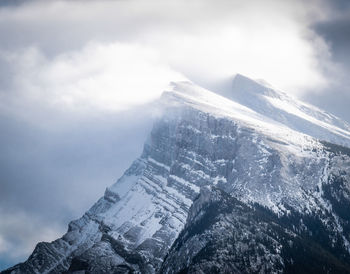 Snowy mountain peak mount rundle covered by snow, detailed shot, banff national park,canada