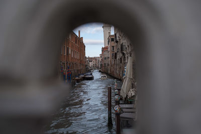 View of canal in sea against sky