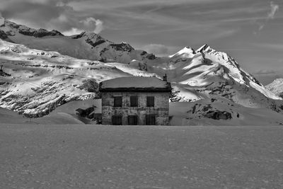 Zermatt houses on snowcapped mountain against sky