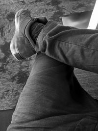 Low section of man relaxing outdoors