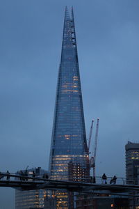 Low angle view of illuminated buildings against sky