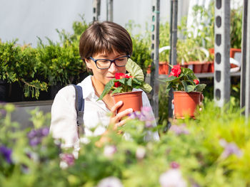 Woman holding potted plant