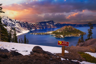 Scenic view of snowcapped mountains against sky during sunset