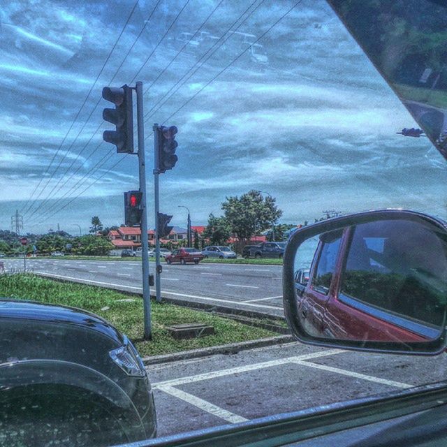 transportation, land vehicle, car, mode of transport, road, street, sky, glass - material, transparent, reflection, tree, side-view mirror, cloud - sky, road marking, day, stationary, vehicle, no people, travel, outdoors