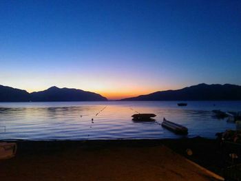 Scenic view of calm lake at sunset