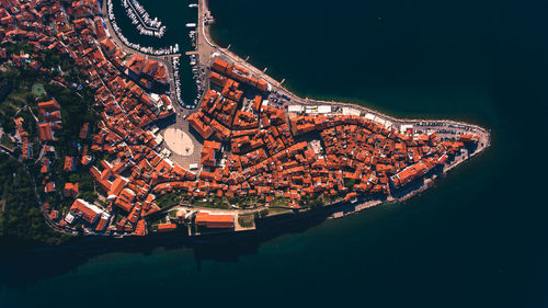 High angle view of illuminated buildings in city at night