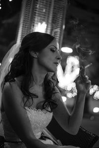 Close-up of young woman smoking