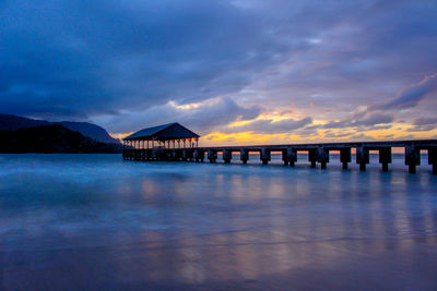 Bridge over sea against sky