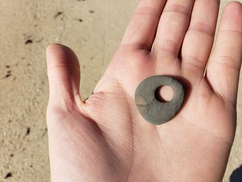 Cropped hand holding stone