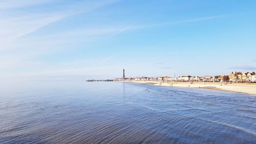 Scenic view of sea against blue sky