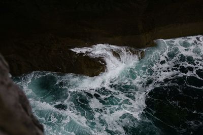 Waves splashing on rocks