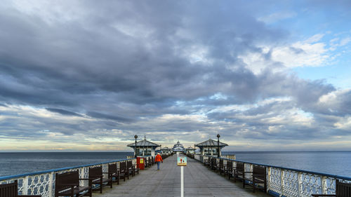 Pier over sea against sky