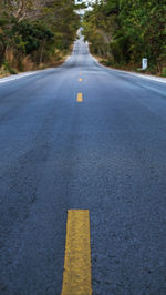 Surface level of road amidst street in city