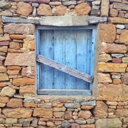 Brick wall with closed door