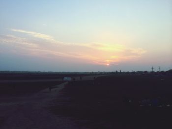 Scenic view of landscape against sky at sunset