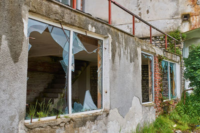 Broken windows of an abandoned hotel