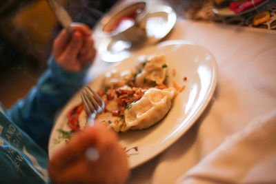 Close-up of man eating food