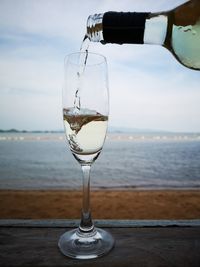 Glass of wine on beach