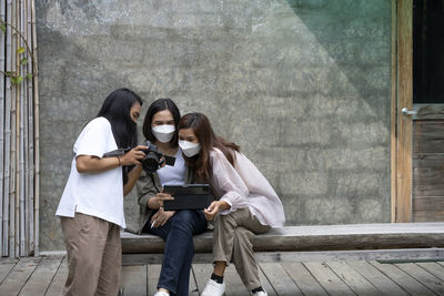 Portrait of woman using phone