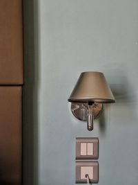 Lamp and switch on wall at home