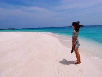 Woman standing on beach