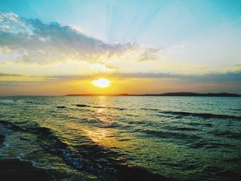 Scenic view of sea against sky during sunset