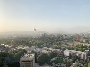 High angle view of buildings in city against clear sky