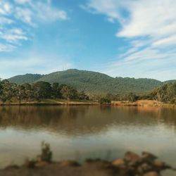 Scenic view of lake with mountains in background