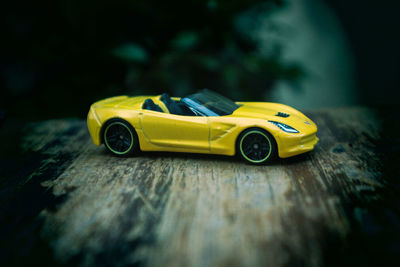 Close-up of yellow toy car on table