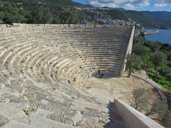 High angle view of woman sitting at amphitheater