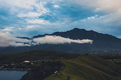 Scenic view of landscape and mountains against sky