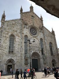 Group of people in front of historic building