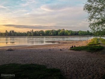 Scenic view of lake against sky during sunset