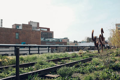 Train on railroad track against sky
