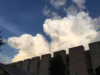 Low angle view of buildings against blue sky