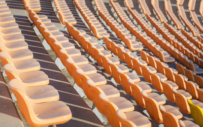 High angle view of empty chairs in row