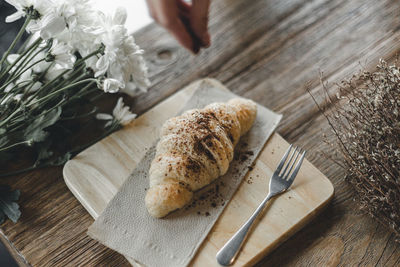 High angle view of bread on cutting board