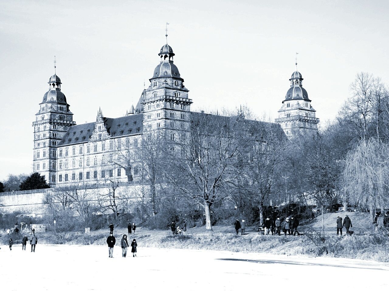 winter, snow, building exterior, cold temperature, travel destinations, architecture, snowing, built structure, outdoors, day, tree, large group of people, sky, city, nature, people, adults only, adult