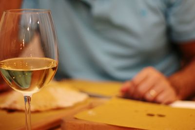 Close-up of wineglass on table