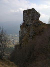 Rock formation on mountain against sky