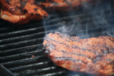 Close-up of meat on barbecue grill